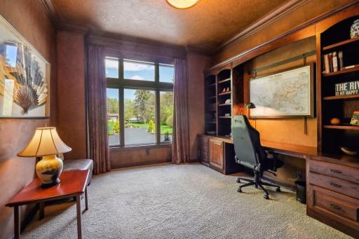 Main level office with built in desk/cabinets or could be used as a second bedroom.