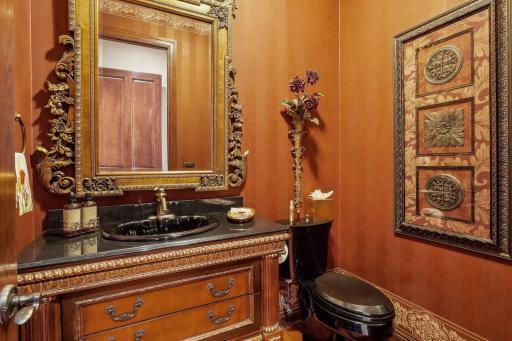 Main level half bath off of the kitchen.