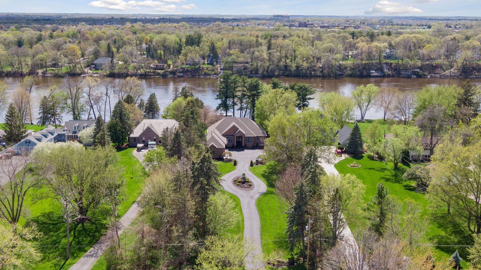 Long driveway along well manicured grounds leading you to home surrounded by mature trees.