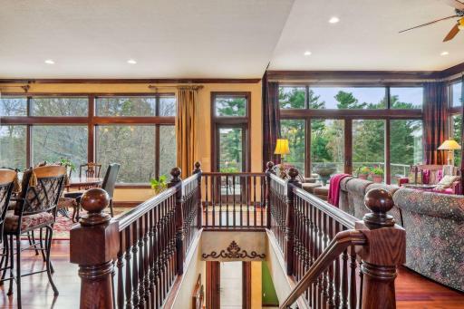 Stairway to lower level with oversized solid oak posts.