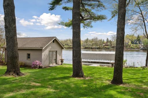 View of boathouse and floating dock with boat canopy.