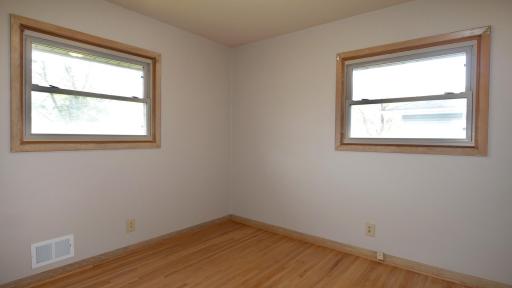 Front Bedroom With Hardwood Floors And Windows For Cross Ventilation..jpg