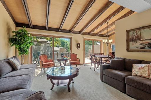 Large living area with Vaulted Ceilings and Deck Access