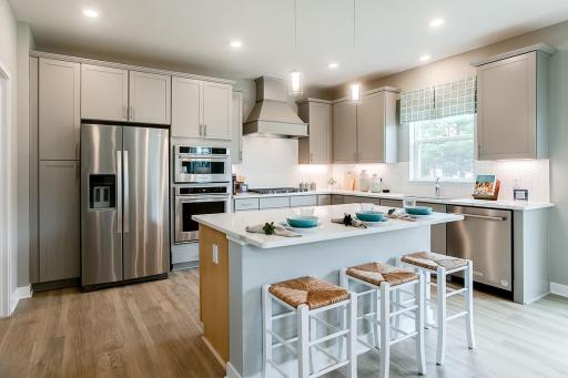 Spacious kitchen with ample counter space. *Photo used is of a former model as an example on how to furnish.