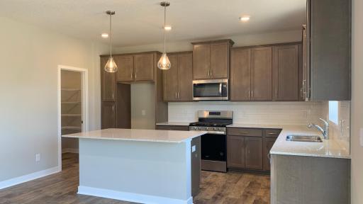 Photo for 1655 Oak Creek Drive, Chaska, MN 55318 - Listing #6501372 Stainless appliances including dishwasher, slide in range with gas top and microwave vented to the outside! Actual photo of home!