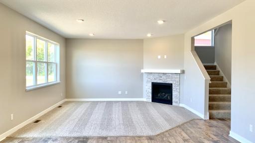 Photo for 1655 Oak Creek Drive, Chaska, MN 55318 - Listing #6501372 Spacious yet cozy family room with lots of natural light and gas fireplace with stone surround and mantel. Actual photo of home!