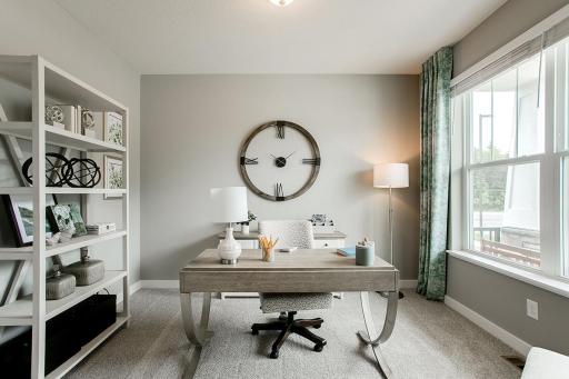 Main floor office. *Photo used is of a former model as an example on how to furnish.