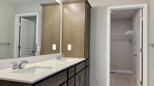 Owners bath! Quartz countertops, double bowl vanity + ample cabinetry for storage.