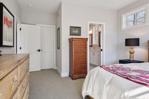 Two upper level bedrooms are connected with a shared bathroom