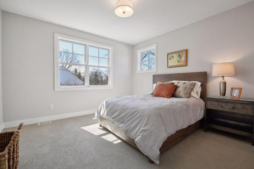 One of three additional bedrooms on the upper level