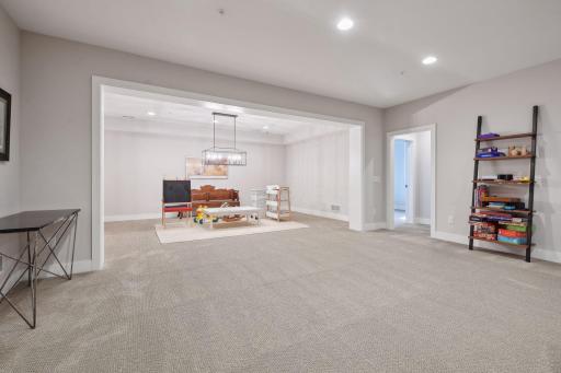 Separate area in lower level works for game table, exercise room, yoga space, etc.
