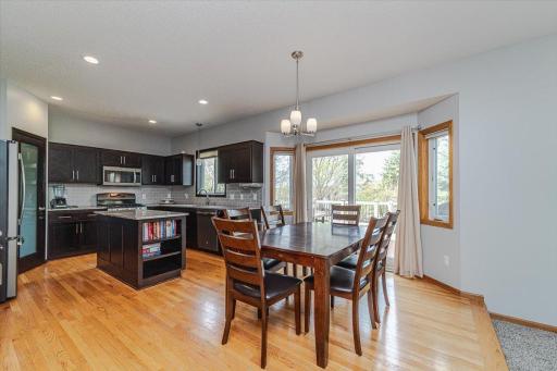 The eat-in kitchen has hardwood flooring and a bayed dinette.