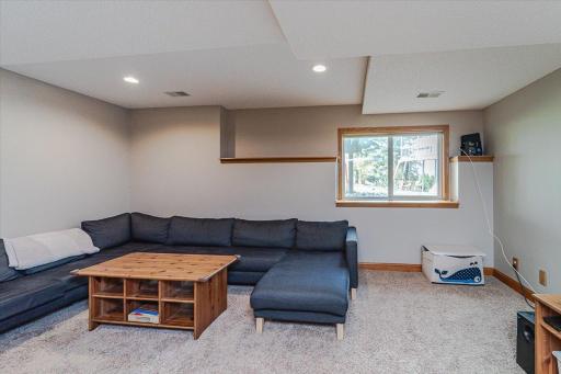 Large windows and new recessed lighting keep the family room bright.