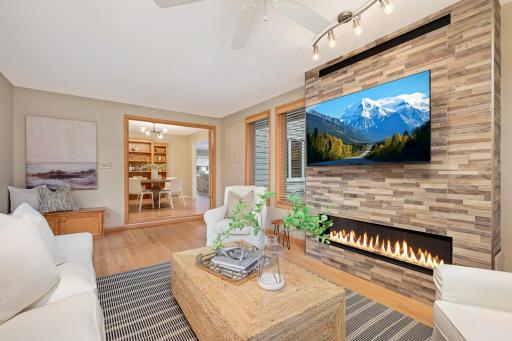 A stunning gas fireplace plus a door to the patio make this a family gathering spot