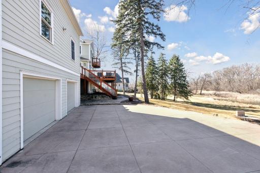 This additional patio space with access to two garage spaces with ample storage options is wonderful for multiple uses!