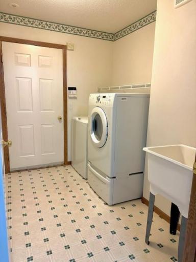 Utility/laundry/mud room with laundry tub, convenient to Kitchen from garage