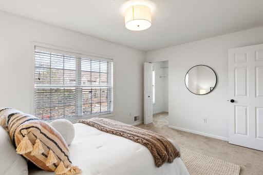 Primary suite has a walk-in closet with a window for natural light!