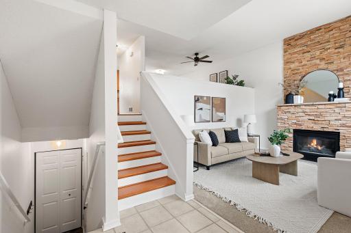 This is what you will see when you step into your new home! Very open with 2-story living room and stone fireplace. Steps go down to the 2-car garage. Steps go up to the kitchen/dining/sitting area/powder room.