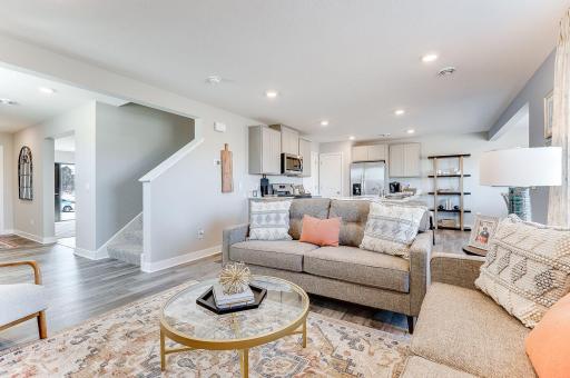 With the kitchen flowing into the living room, it makes for a great gathering space for family & friends. Photo of model home, color & options will vary.