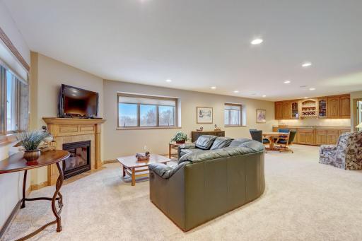 Discover the walk-out lower level, an entertainer's dream with heated floors throughout.