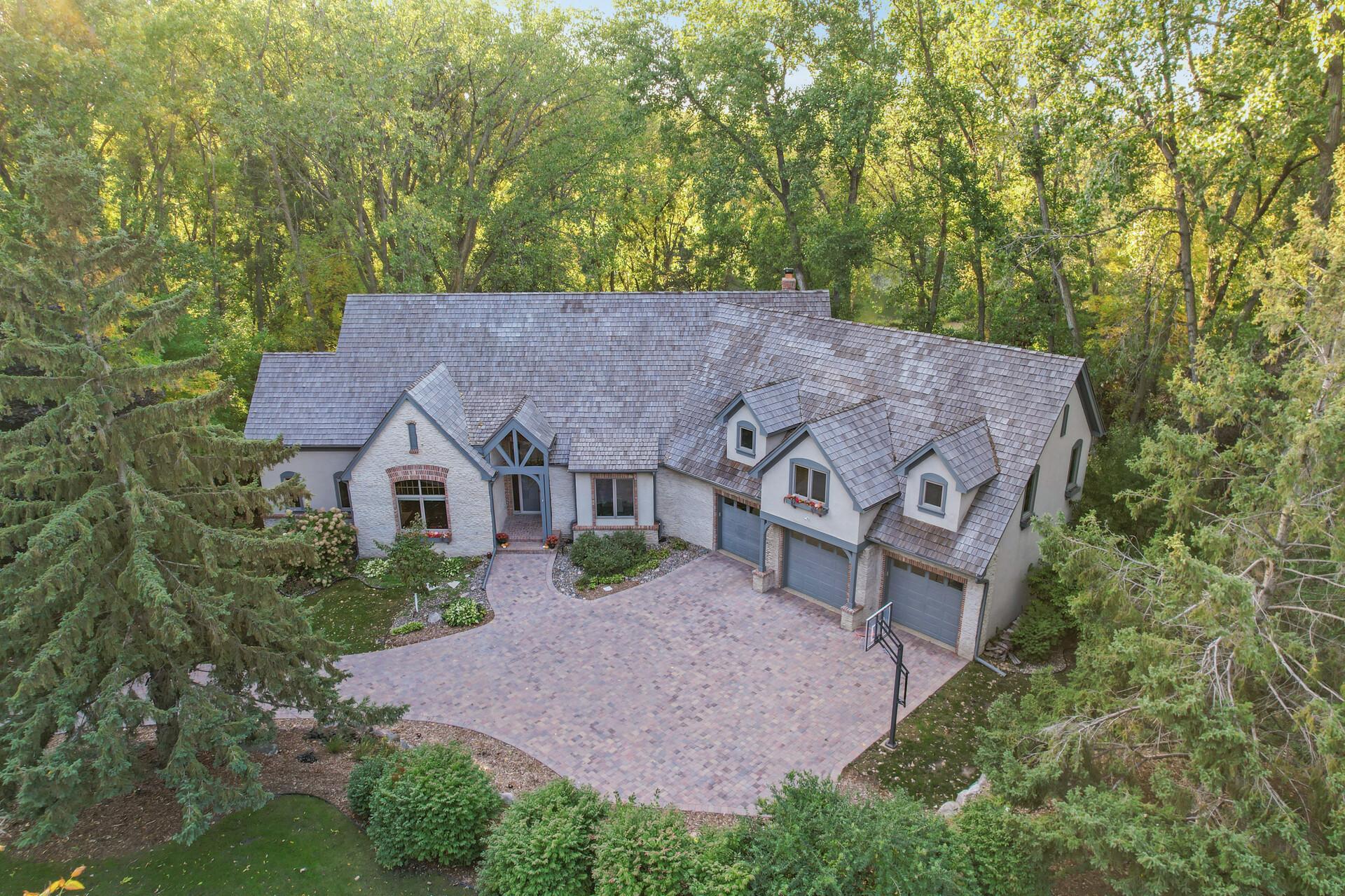 This remarkable property also boasts the rare privilege of a deeded private dock, ensuring that every day can be a lake day.