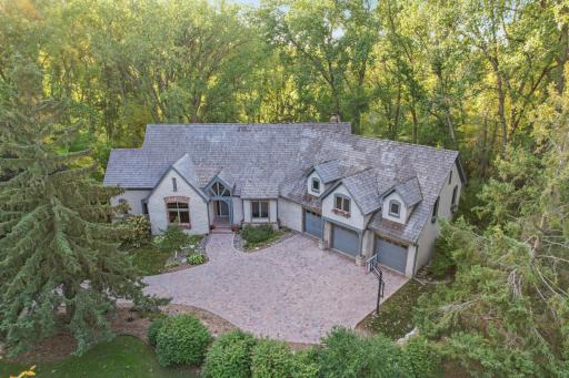 This remarkable property also boasts the rare privilege of a deeded private dock, ensuring that every day can be a lake day.