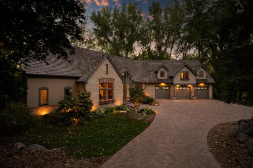 From the moment you approach, you'll be captivated by the charming French country ambiance that graces every inch of this residence.