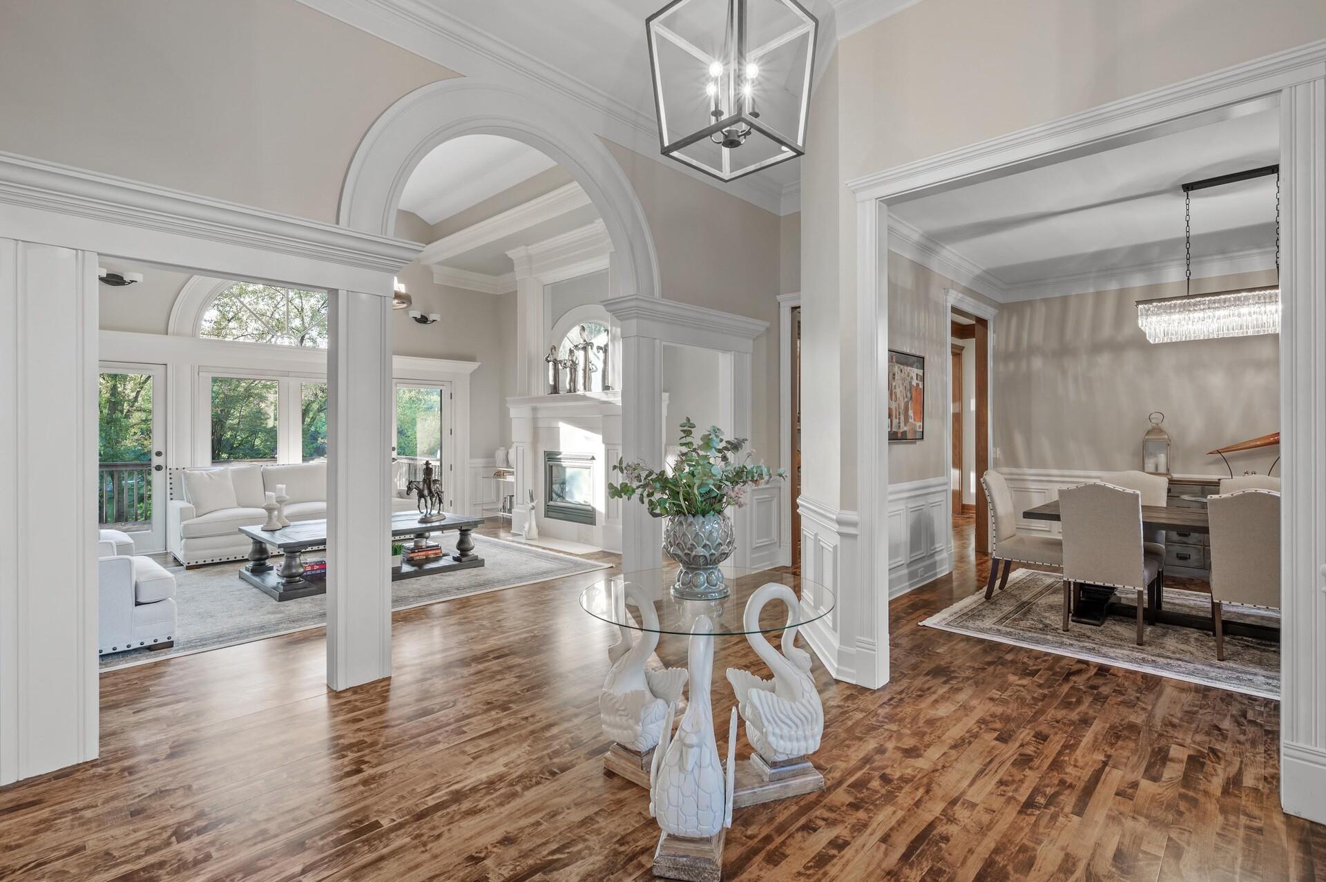 As you step into the foyer, you'll be greeted by soaring 12-foot ceilings that gracefully extend throughout the main level.
