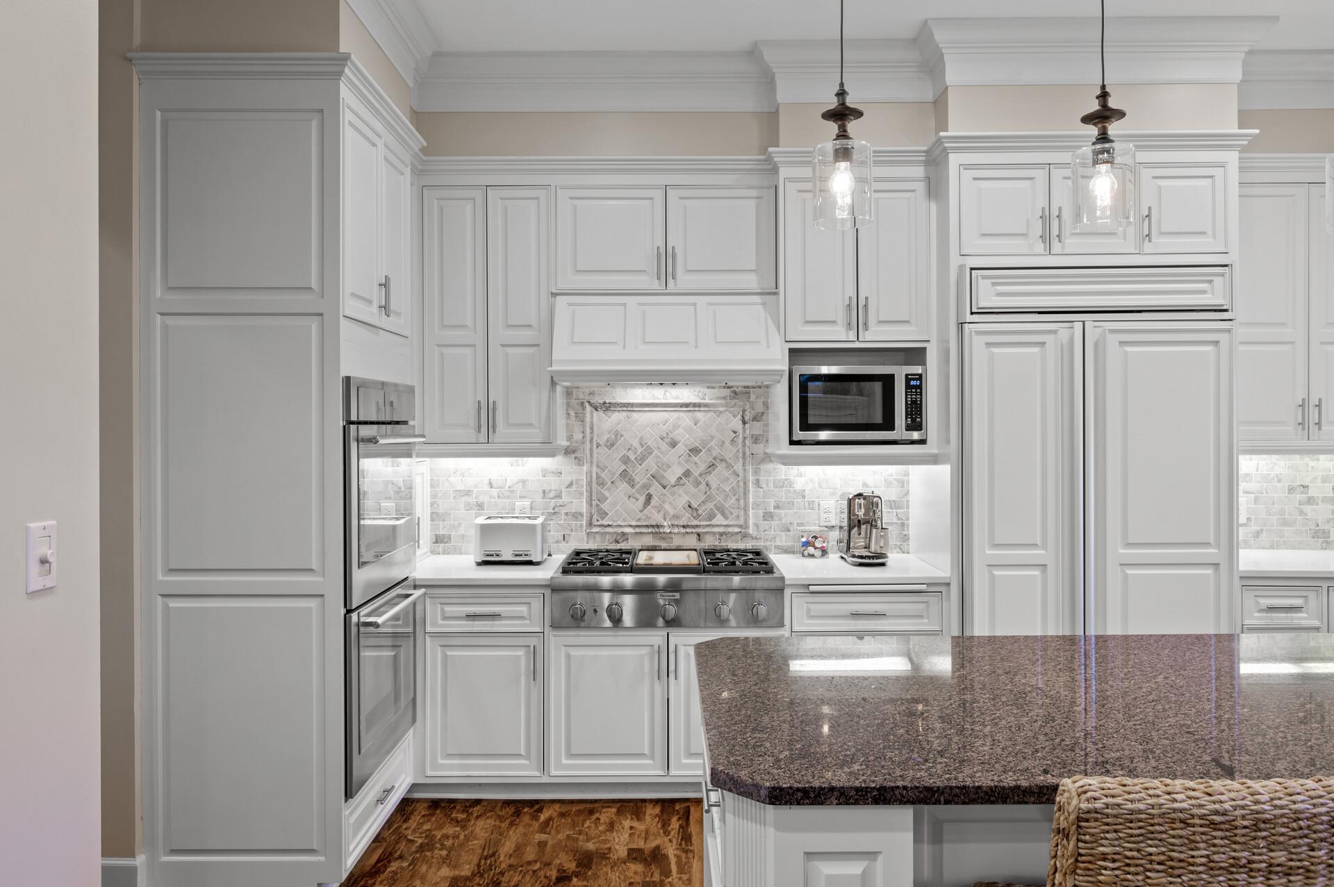 The large center island invites gatherings and conversations, while the double wall oven and gas cooktop with an exhaust fan ensure culinary excellence. The Culligan reverse osmosis drinking water system, new Culligan water softener & filter system.