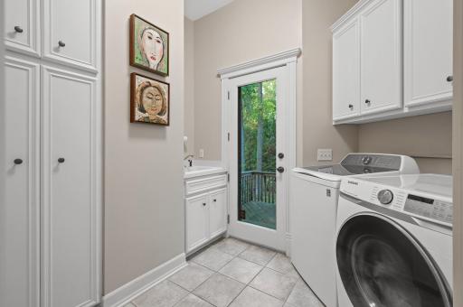Convenient main level laundry room with access to the backyard.