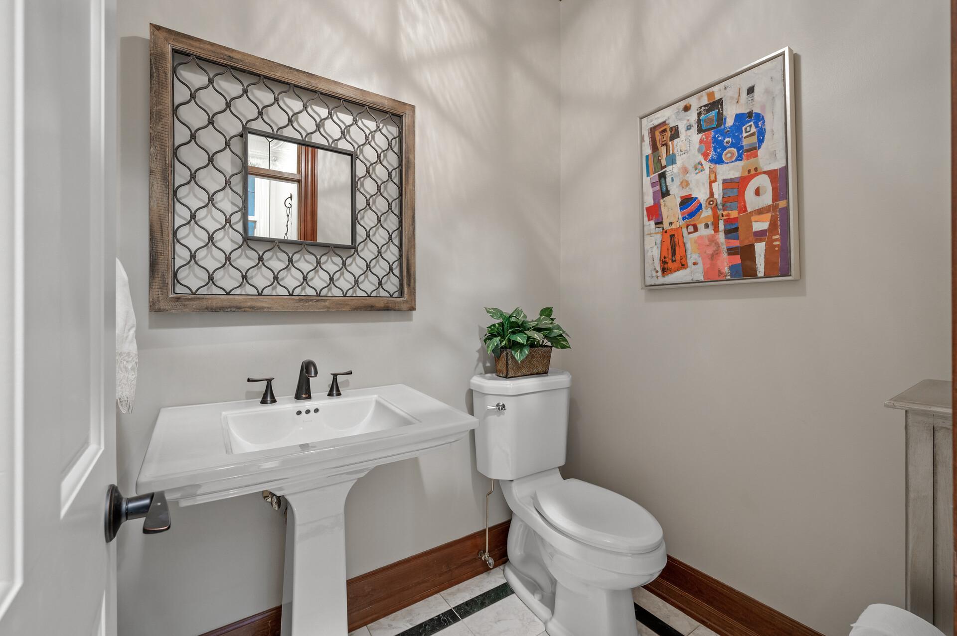 Practical main level half bathroom.
