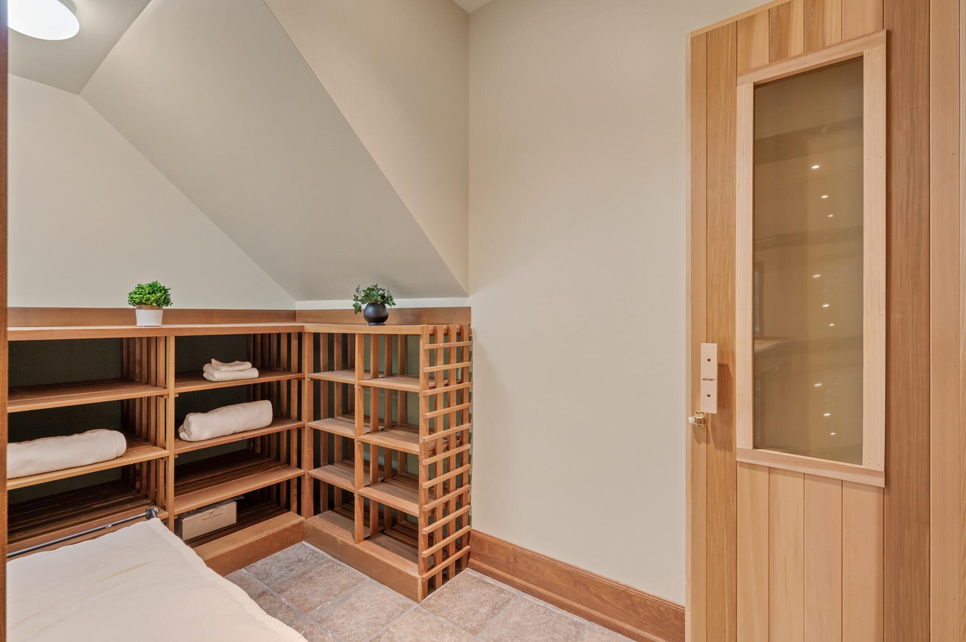 Lower level wine cellar with access to the sauna.