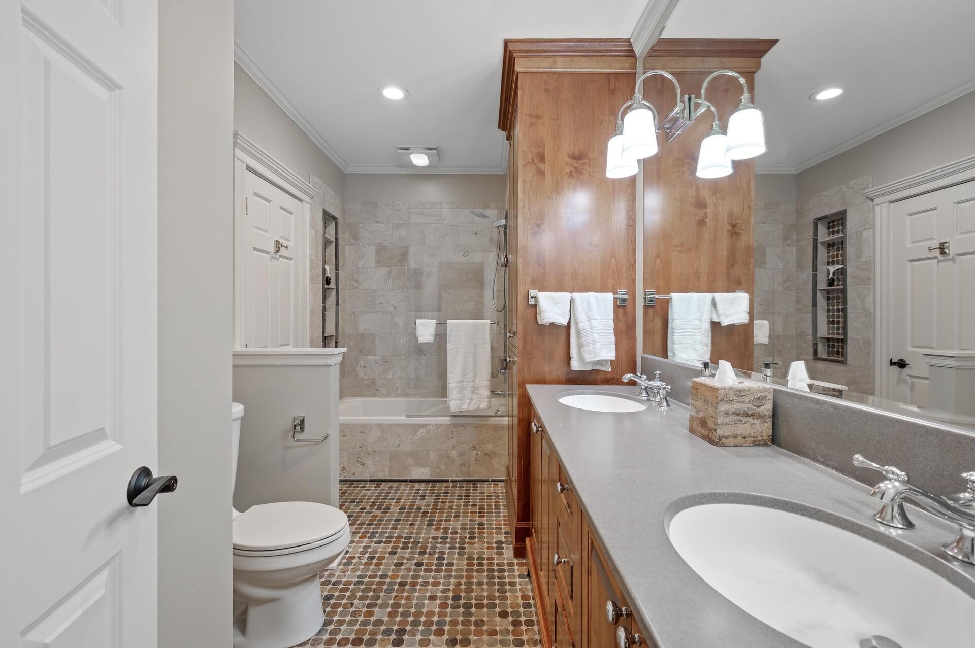 Shared full bathroom on the lower level.