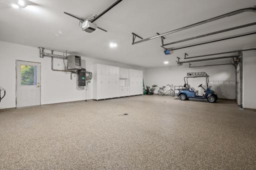 This residence also features an attached 3-car garage with newly epoxied floors and a California closet system for extra organization.