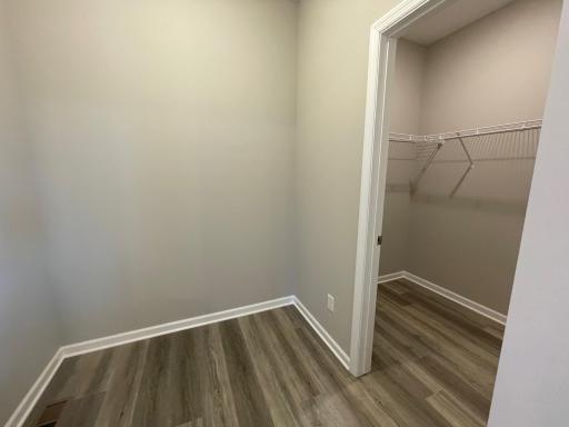 Mudroom offers a spacious walk-in closet and room for a future bench.