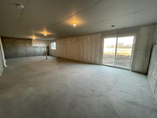 Unfinished walkout lower level. Can be finished in the future with a family room, bath, and 5th bedroom.