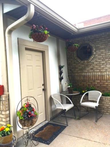 Small patio off front door is a great place to relax and enjoy a morning cup of coffee!