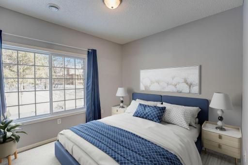 Second bedroom with oversized windows and gorgeous natural light. This room has been virtually staged.