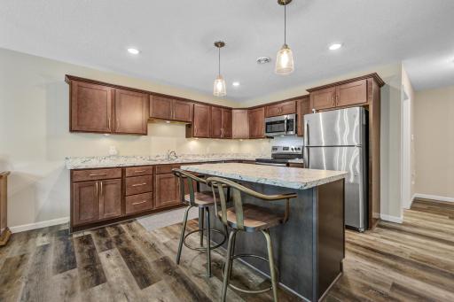 Open and bright kitchen with center island and seating