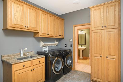 Main floor laundry/mudroom has great storage and is large!