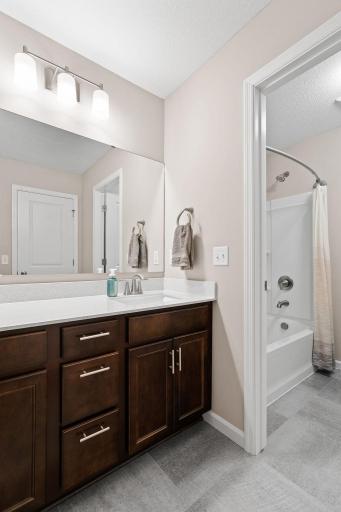 Guest full bathroom on upper level. Upgraded finishes throughout.