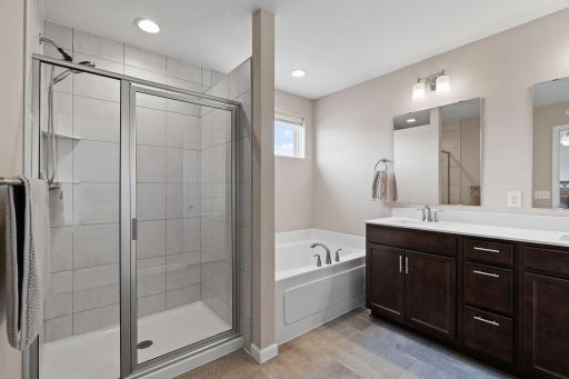 Private full primary bathroom. Dual sinks. Quartz counter tops. Relax, wash, and get ready for the day in this beautiful full bathroom.