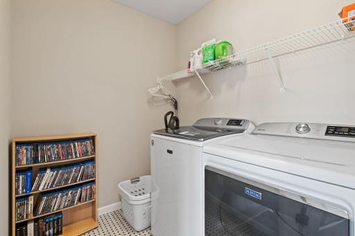 Utility room on upper level across from primary bedroom. Upgraded washer and dryer.