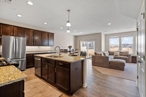 Enjoy this open kitchen with beautiful granite counter tops and a large center island that can work as a breakfast bar.