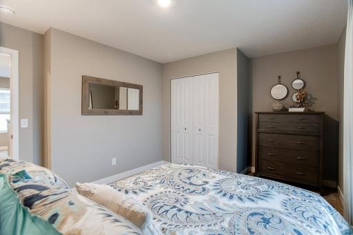 Each of the home's three secondary upper level bedrooms are abundant in space! (Photos of the same floorplan, colors are similar).