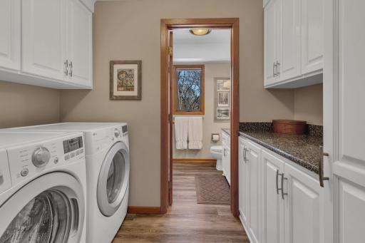Main Floor laundry with plenty of linen space and a lovely 3/4 bath!