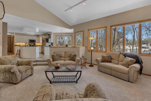 Ideal for family gatherings, this sunken family room makes for easy conversation to those in the kitchen ~ the heart of the home!