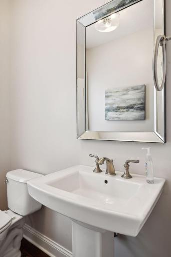 The half bath and large entry closet are located in a hallway off the entry.