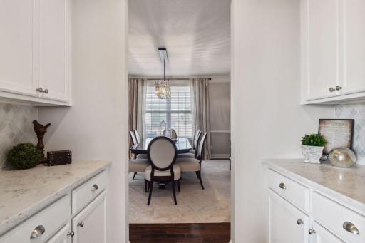 The butler's pantry, presented between the kitchen/informal dining to the formal is perfect for serving and storing additional entertaining items.
