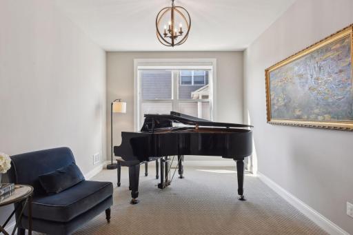 This home provides two main floor special features, besides the main floor office, this is another main floor flex space, currently used as a music room, could also be used as a second office space.